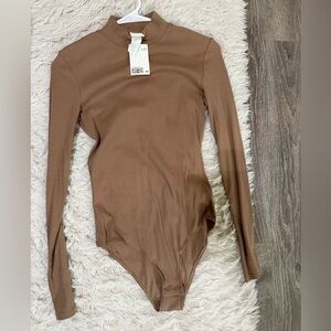 NWT H&M long sleeve bodysuit.